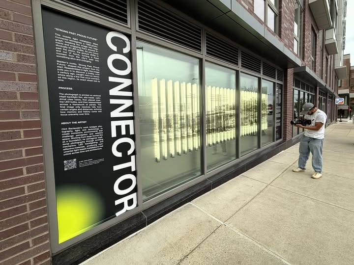 Image accompanying source report: MassArt alum brings illuminated artwork to a Malden public window