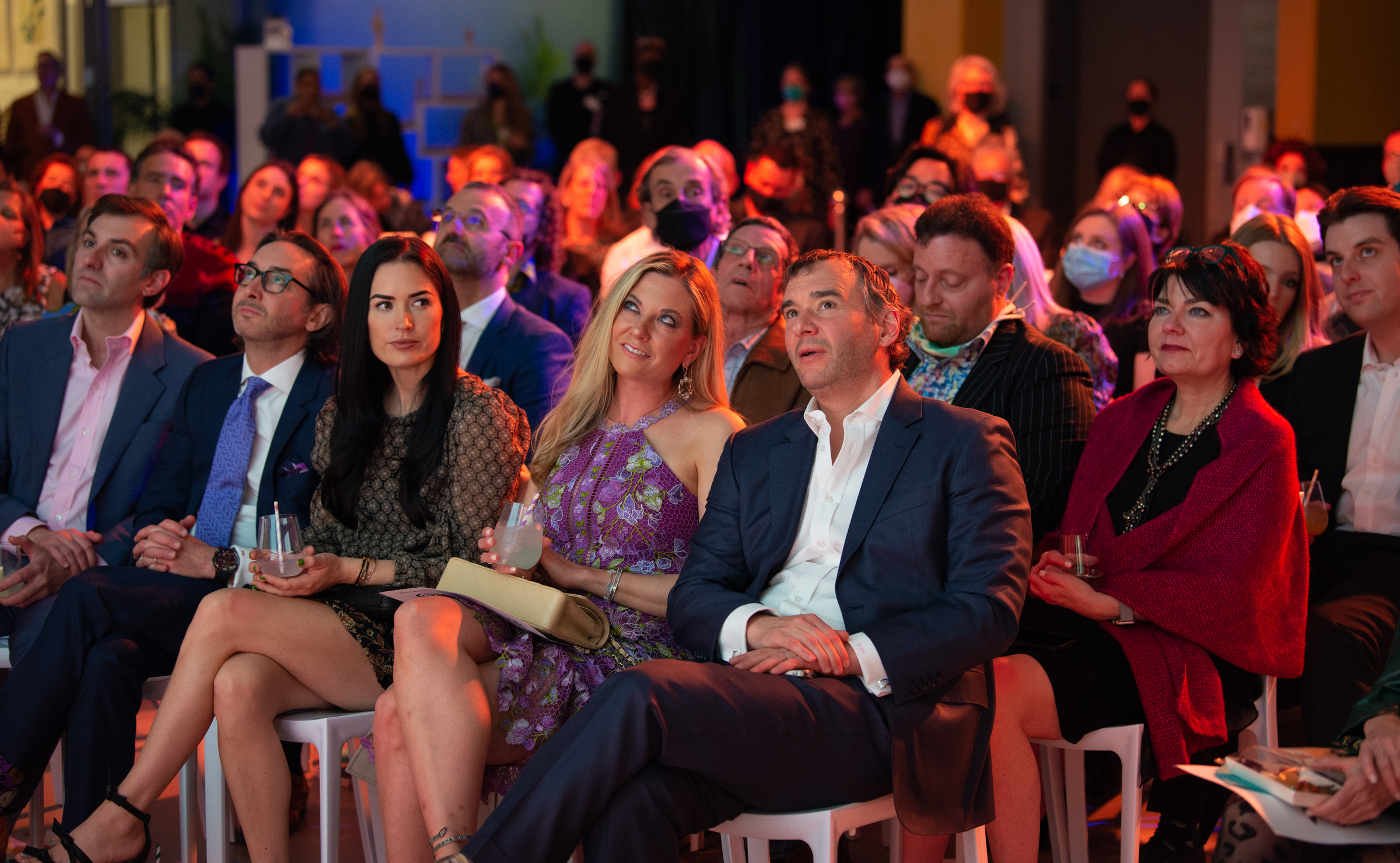 MassArt Live Auction and Party guests viewing artwork on April 9, 2022 in MassArt's Design and Media Center