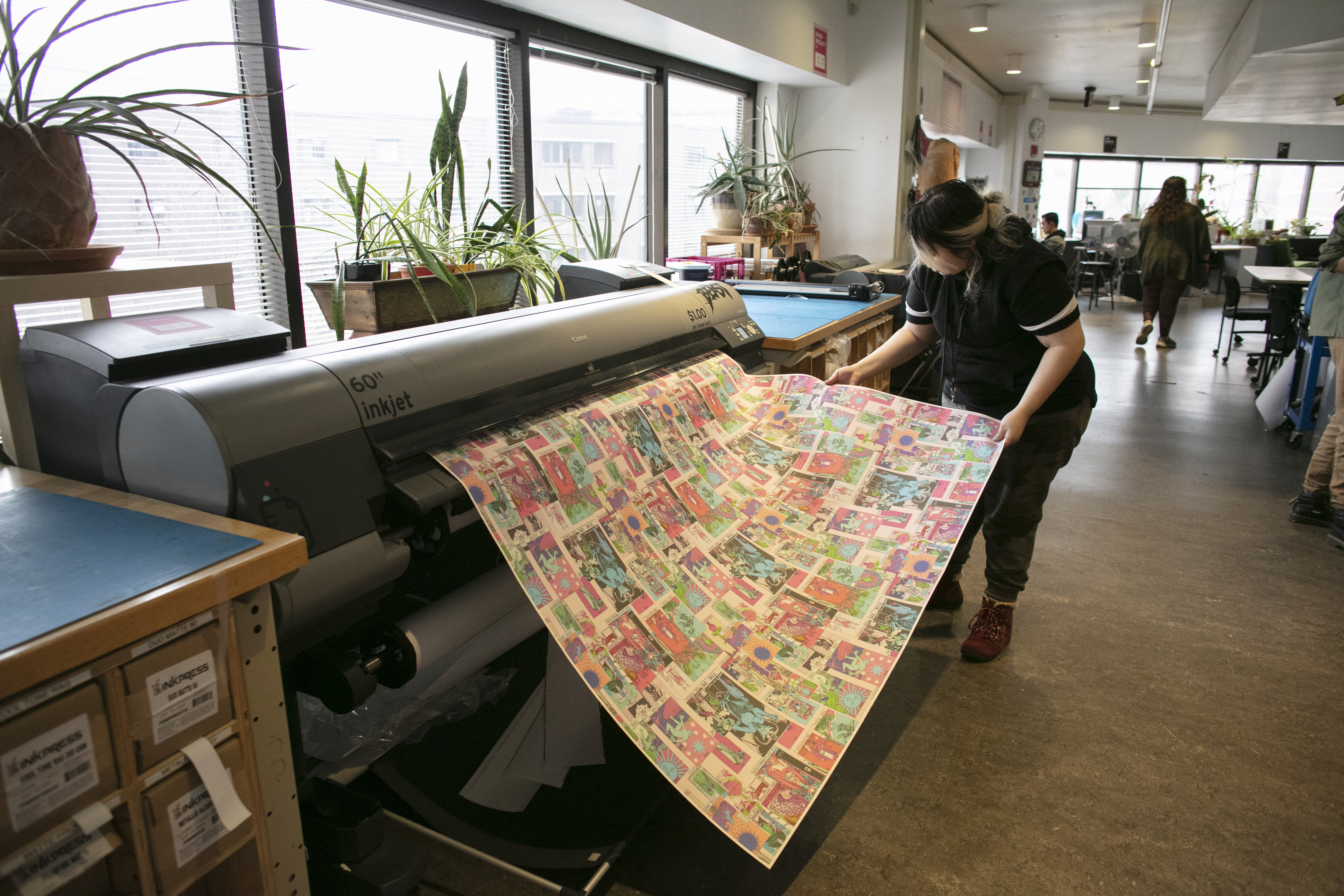 A student printing on the 60" Inkjet printer in MassArt's 3rd Floor Print Lab