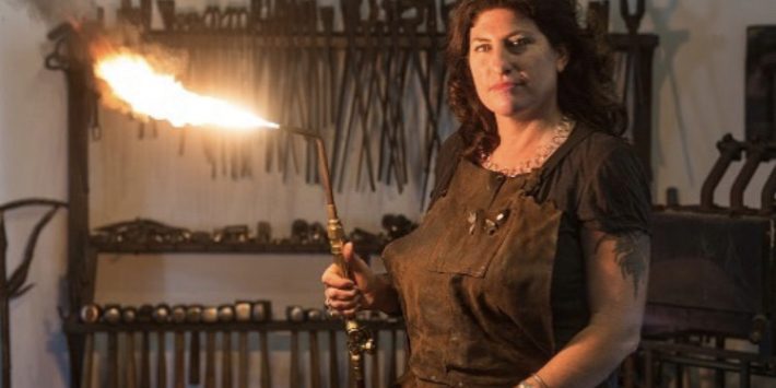 Atlanta artist Corrina Sephora specializes in metal sculpture, painting and elaborate installations. CREDIT JERRY SIEGEL Corrina Sephora shown with a torch in a metalsmith shop.
