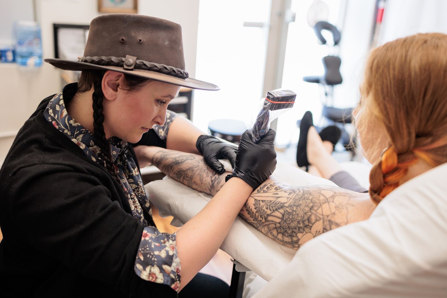 Alexis Rosasco, a tattoo artist and the owner of AR Designs Fine Art & Tattoo, is seen tattooing Brittany Hamilton of Dalton, in North Adams on Feb. 6, 2022.MATTHEW CAVANAUGH/FOR THE BOSTON GLOBE Alexis Rosasco, a tattoo artist and the owner of AR Designs Fine Art & Tattoo, is seen tattooing Brittany Hamilton of Dalton, in North Adams